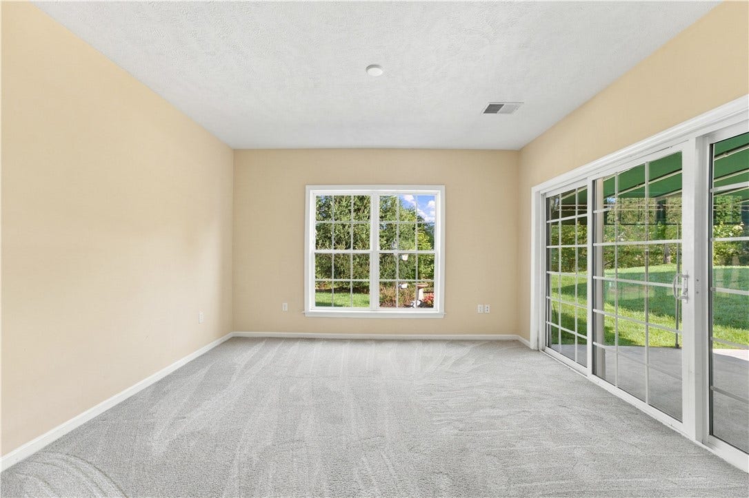 The Rear Sunroom is Ideal for Home Office Space or a Library