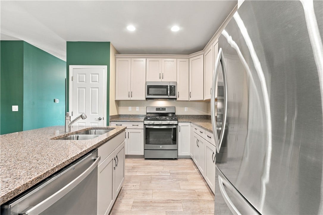 Don't Miss the Quartz Counter Tops and Newer Porcelain Tile Floorng