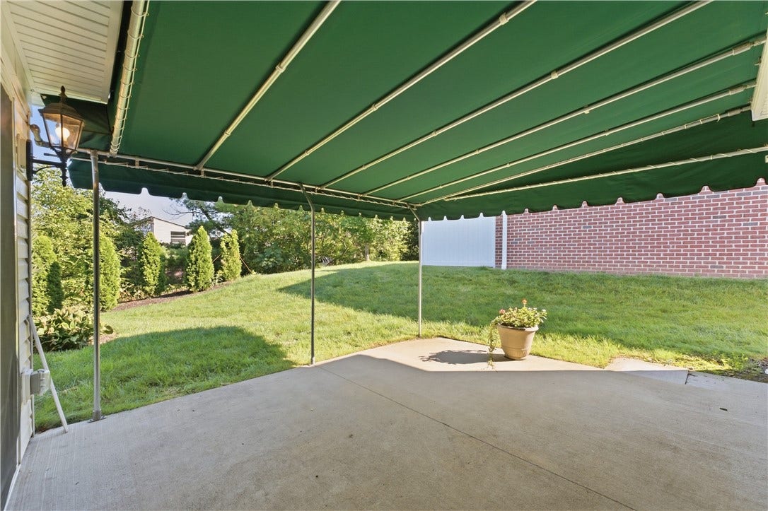 Rear Patio with Awning for Relaxation or Entertaining
