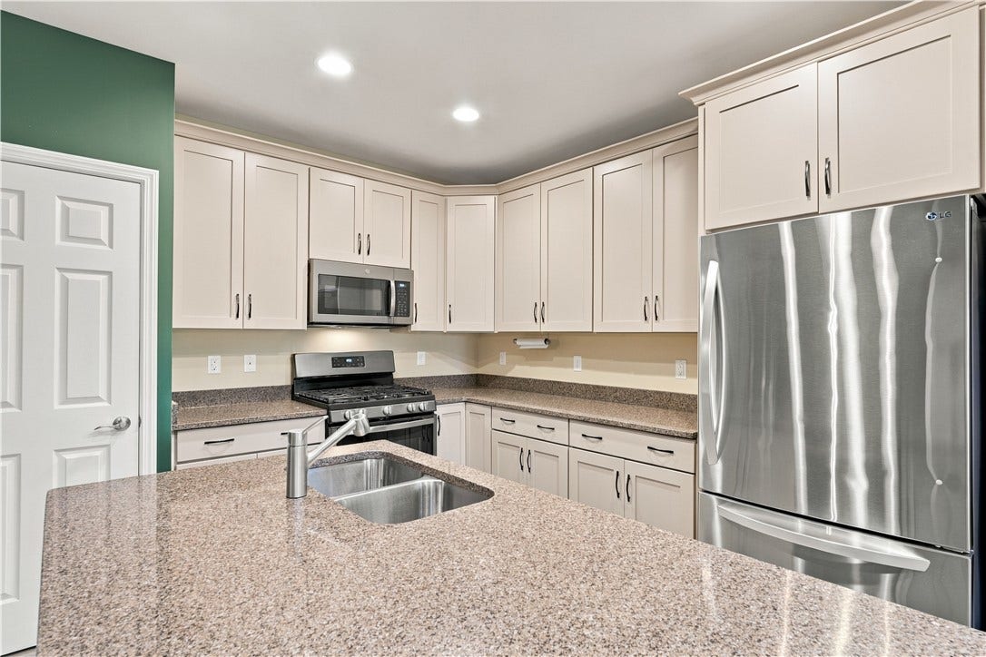 Appliances Include a LG Stainless Refrigerator and a 5-Burner GE Gas Stove