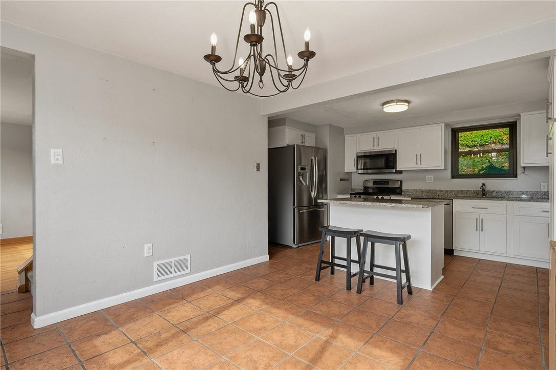 2724 Dwight Ave, Pittsburgh, PA 15216 Tile Floors And Neutral Paint Highlight The Kitchen And Dining Room