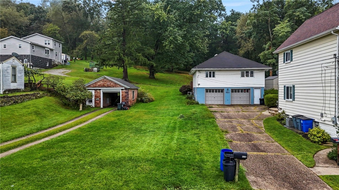 Rear of structure. Long driveway for extra parking!