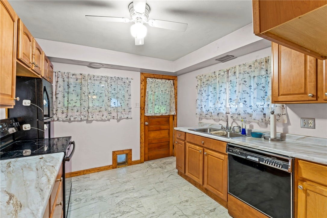 The kitchen is right off the front porch, perfect for cookouts!