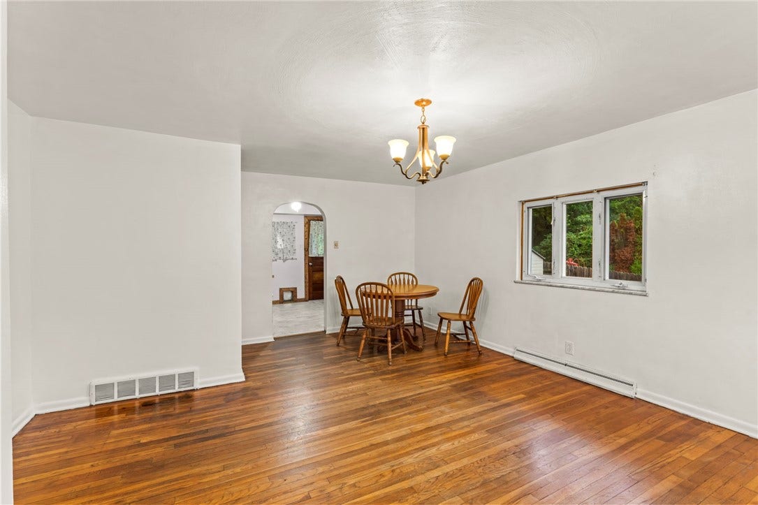 Another view of the living/dining room area looking into the kitchen.