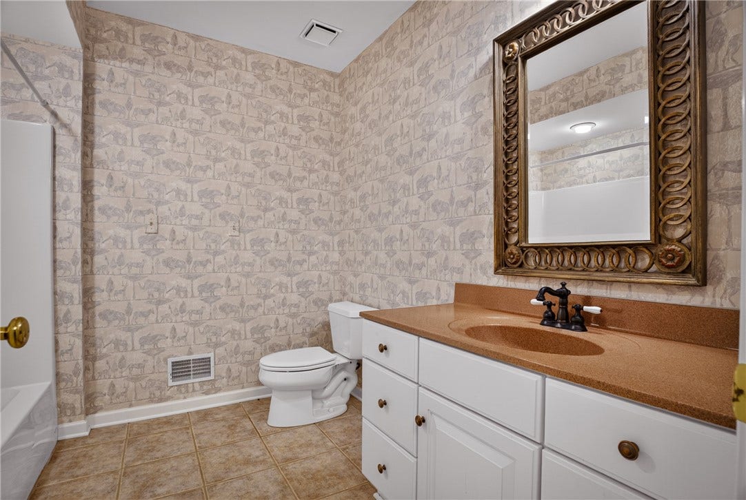 FULL BATH SERVES THE LOWER LEVEL.