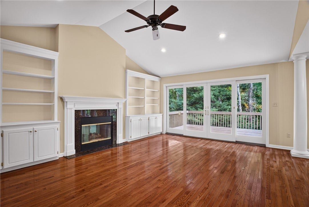 VAULTED CEILINGS ENHANCE THE OPEN AND AIRY LIVING ROOM.
