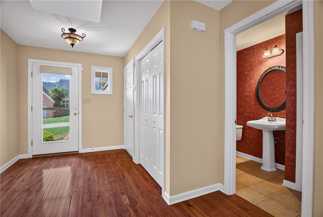CONVENIENT MAIN LEVEL POWDER ROOM.