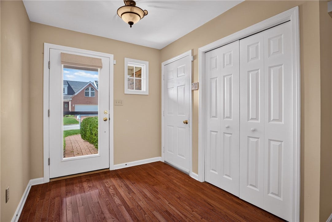 WELCOMING ENTRY WITH HARDWOOD FLOORS.