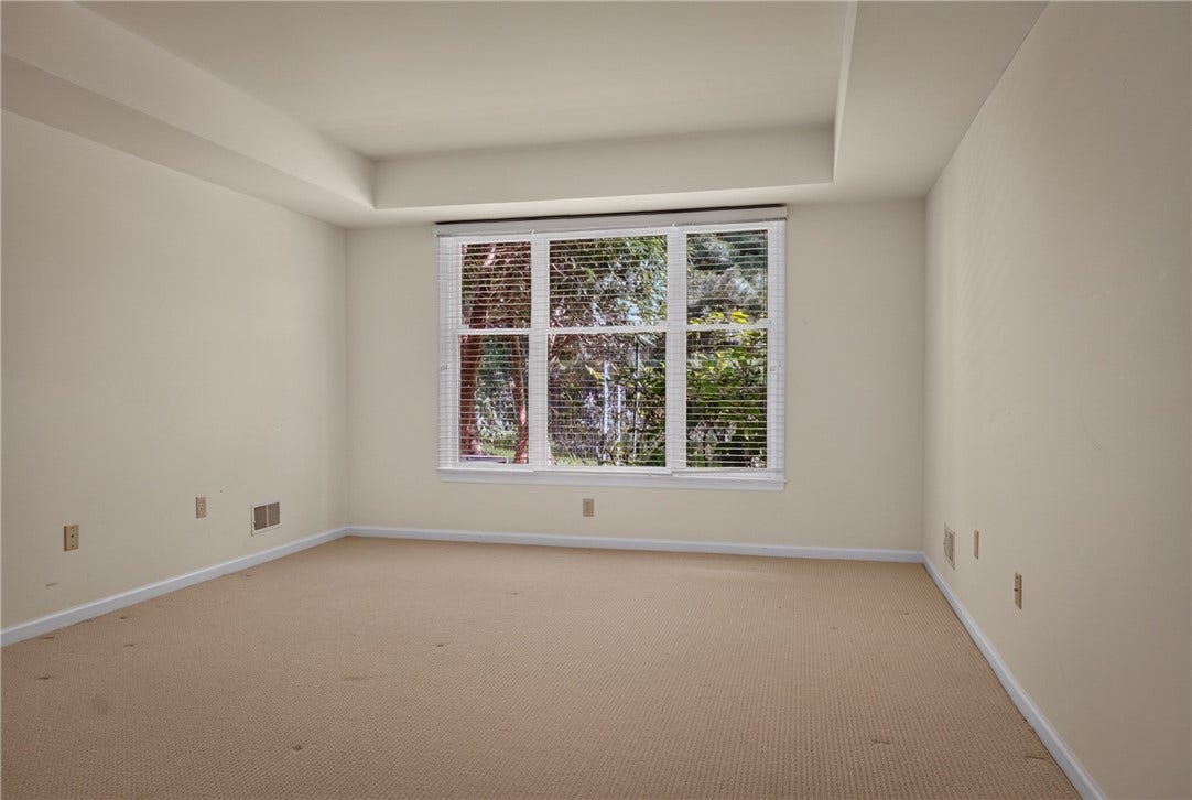 LOWER LEVEL BEDROOM OFFERS PRIVACY AND CONVENIENT ACCESS TO A FULL BATH.