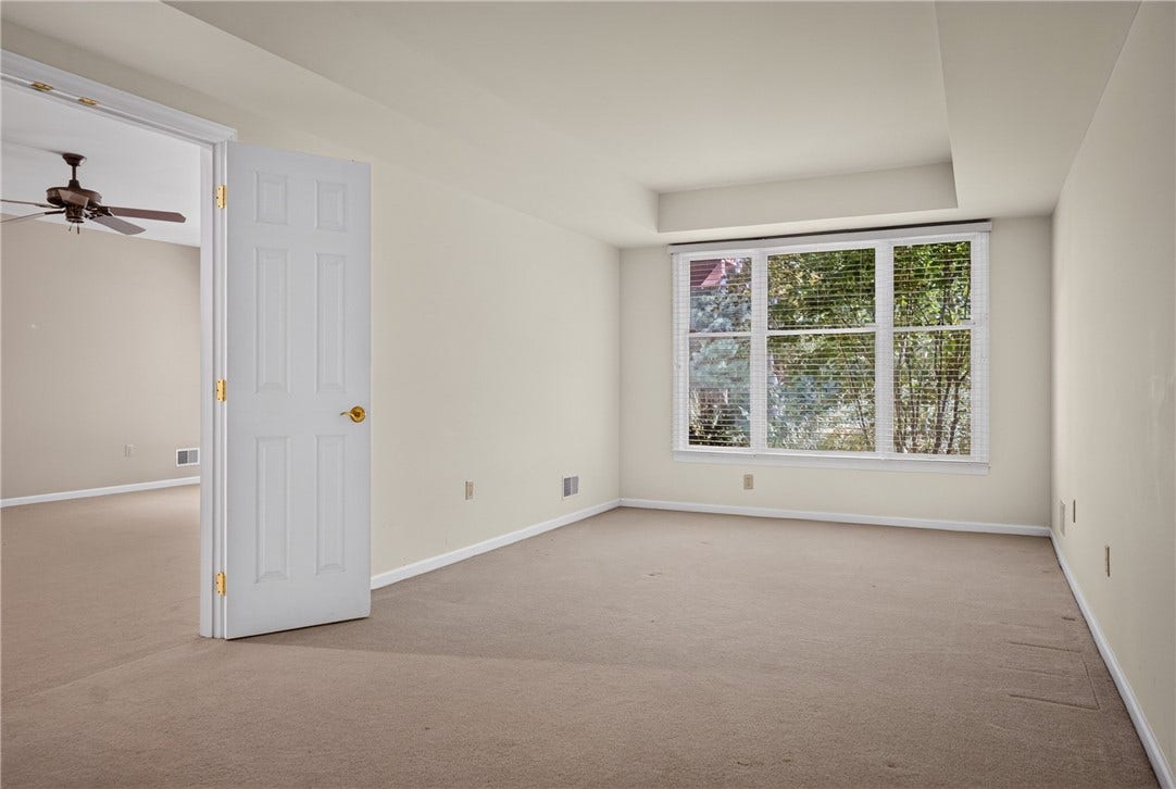 LOWER LEVEL BEDROOM IS IDEAL FOR GUESTS OR A HOME OFFICE.