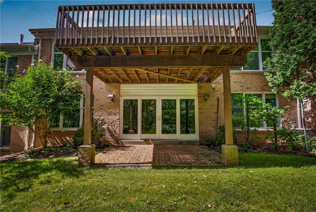 A PRIVATE OUTDOOR RETREAT SURROUNDED BY MATURE TREES.