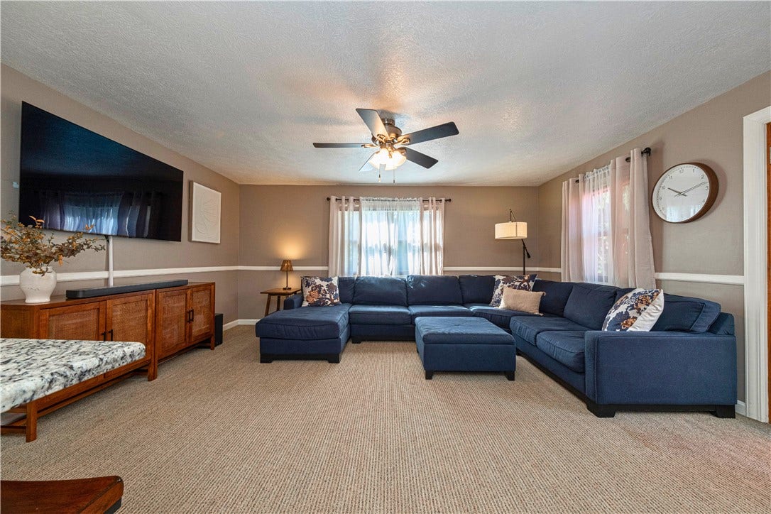 Spacious family room with an open layout and direct access to the deck and gazebo.