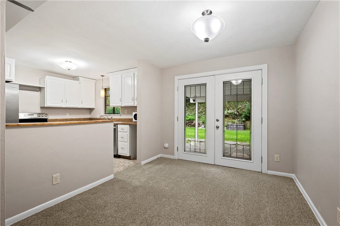 127 Sheldon Ave, Pittsburgh, PA 15220 Dining room is situated between living room and kitchen with French door to the covered patio and fenced-in backyard.