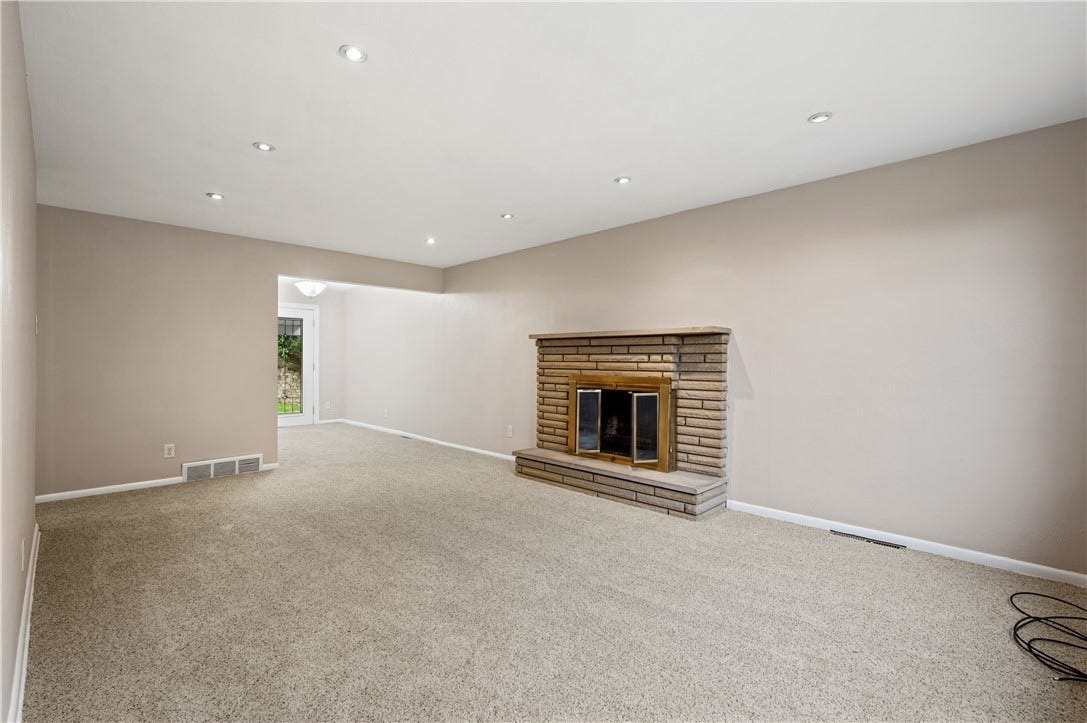 127 Sheldon Ave, Pittsburgh, PA 15220 New carpet and fresh paint the living room has recessed lighting and the stone fireplace is a beautiful focal point.