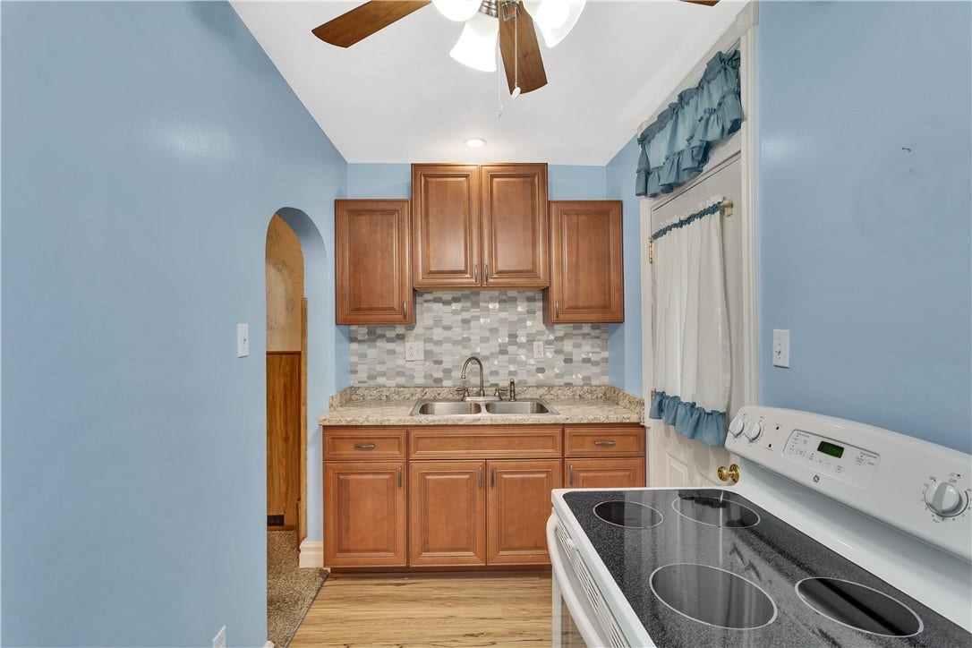 With updated cabinets and laminate flooring