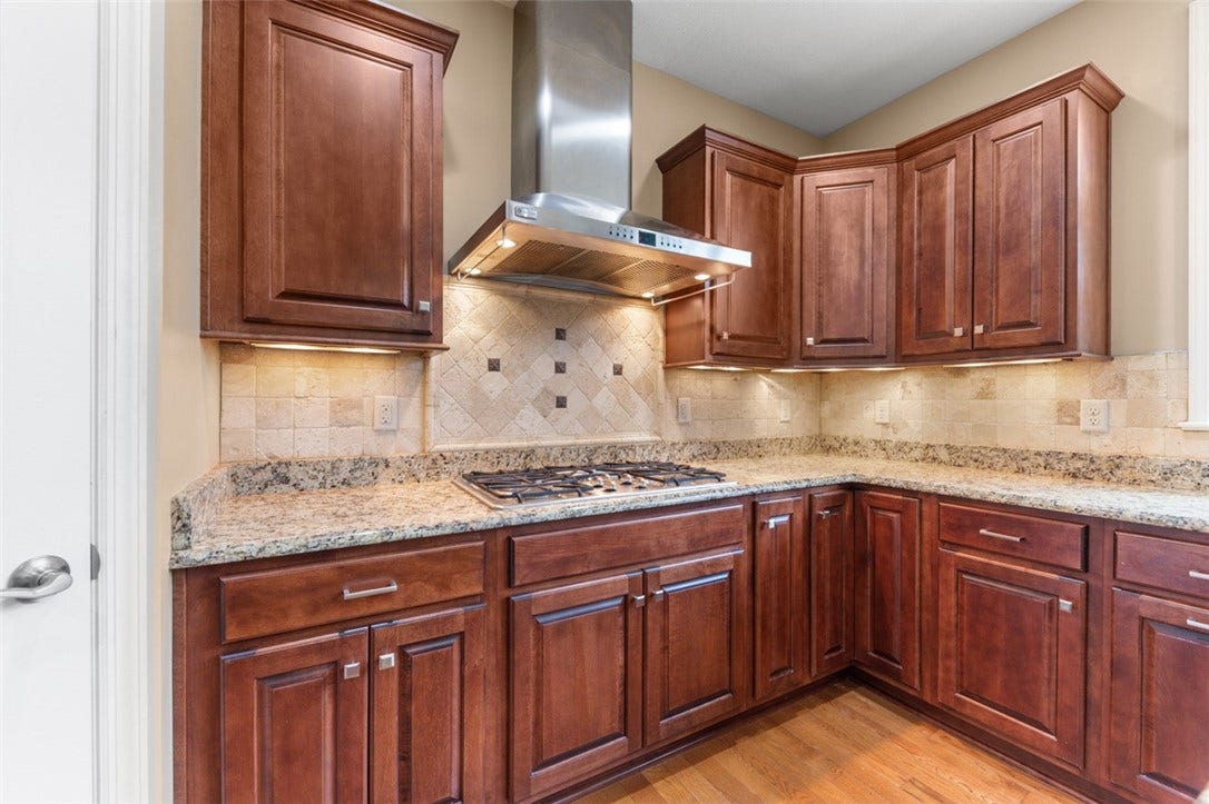 Cook top and vented Hood. Pull out drawers.