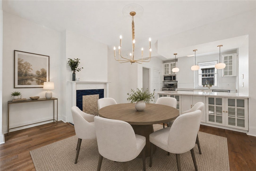 Dining area open to the kitchen - Virtually staged
