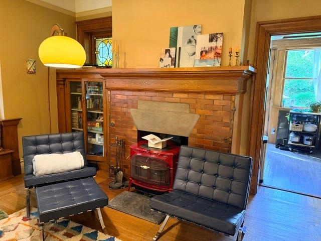 Living room features wood burning stove