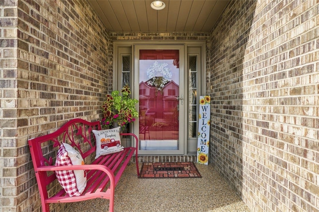 Covered, level-entry front porch offers a welcoming entrance.