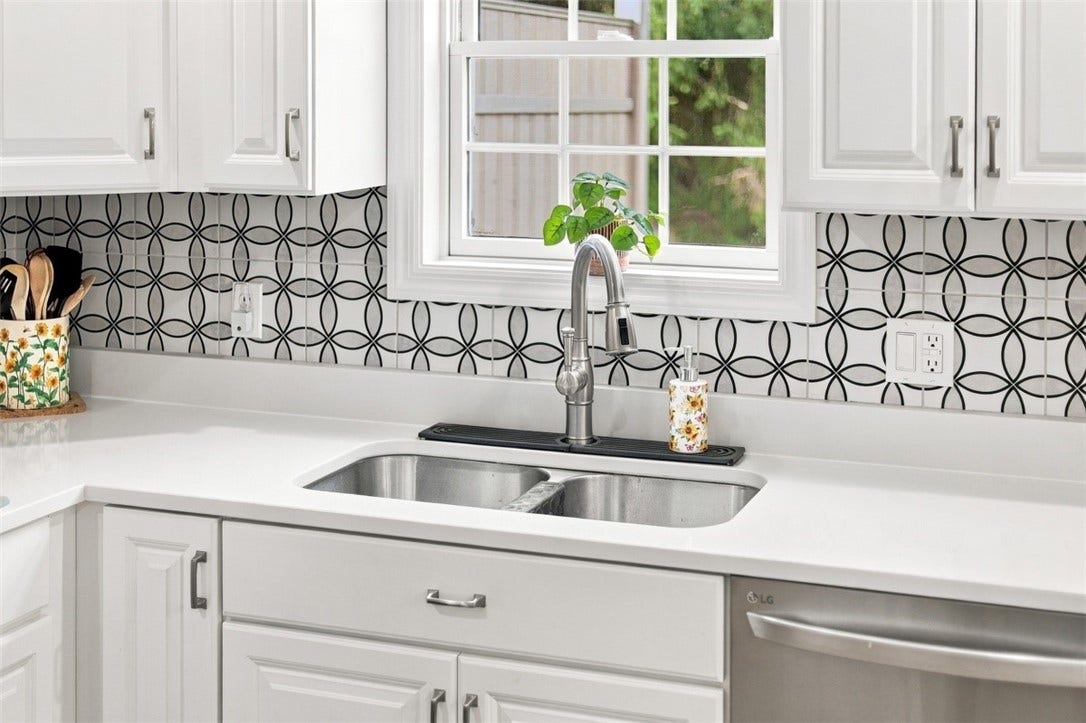 Even doing dishes is a pleasure with views overlooking the backyard and patio.