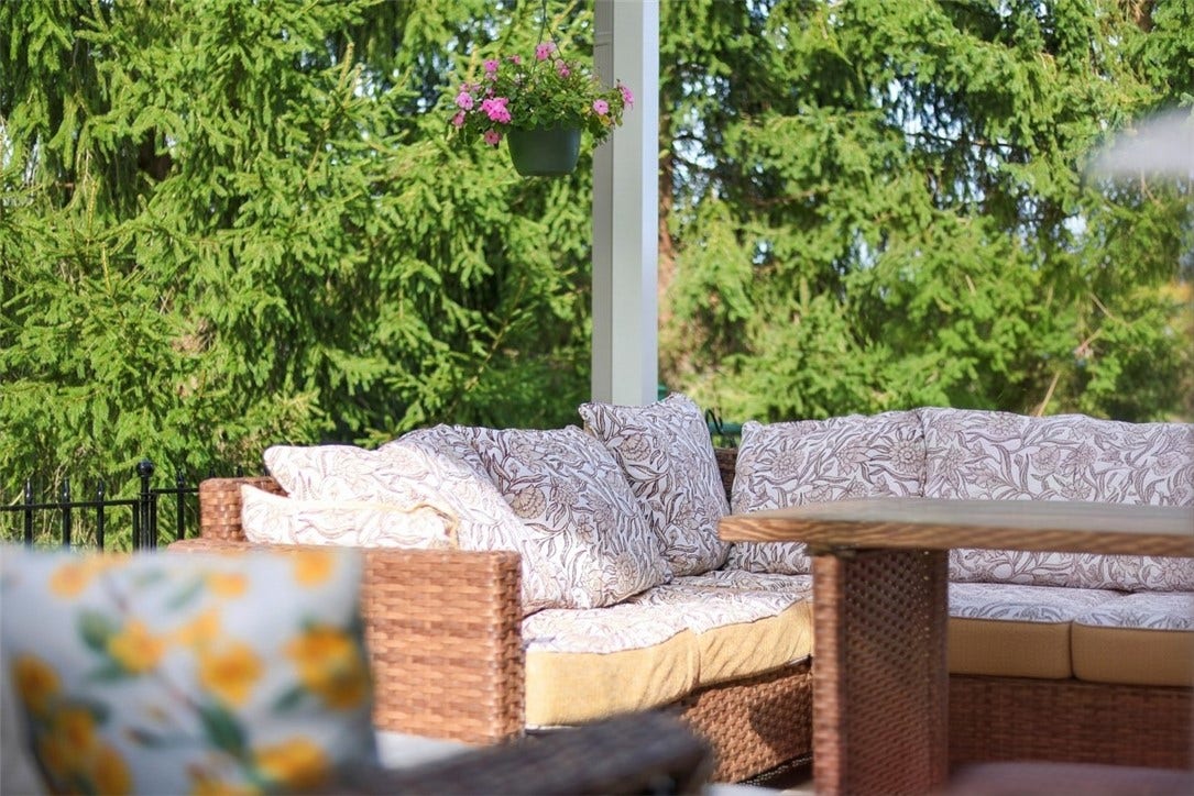 A wall of mature evergreens creates a beautiful natural backdrop while providing year-round privacy.