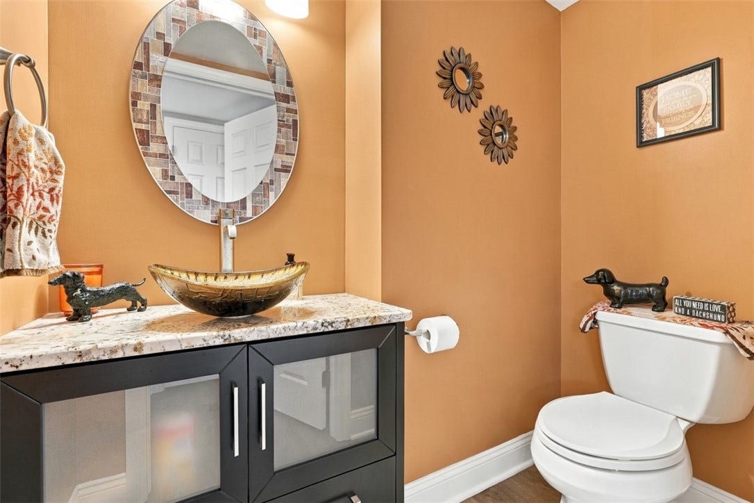 Modern, updated half bath conveniently located just off the main living area.
