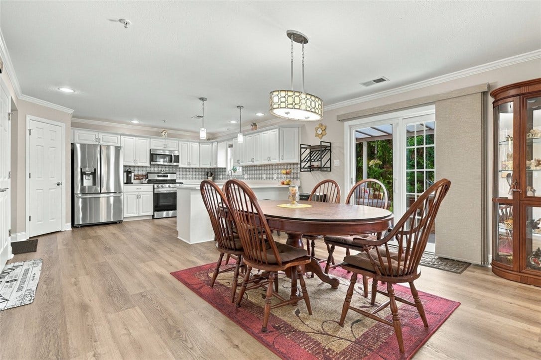 Designated dining area adjacent to the kitchen offers plenty of space for everyday dining and entertaining.
