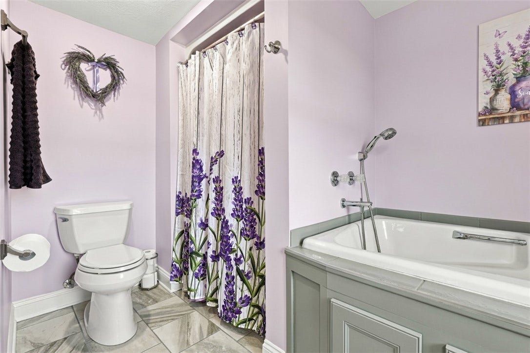 Separate walk-in shower adds convenience to the spacious primary en suite.