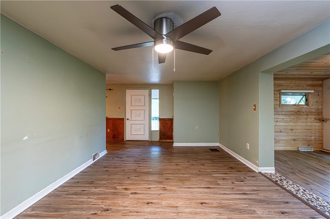 LIVING ROOM SHOWING FRONT DOOR