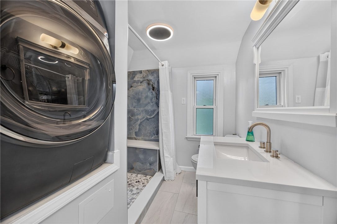 Hall Bath, large walk in shower, large vanity, modern design, full size all-in-one washer-dryer