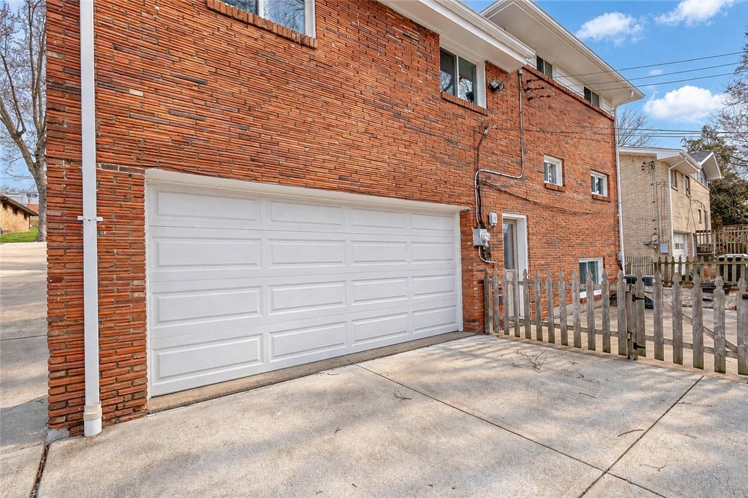Spacious garage has plenty of storage space.