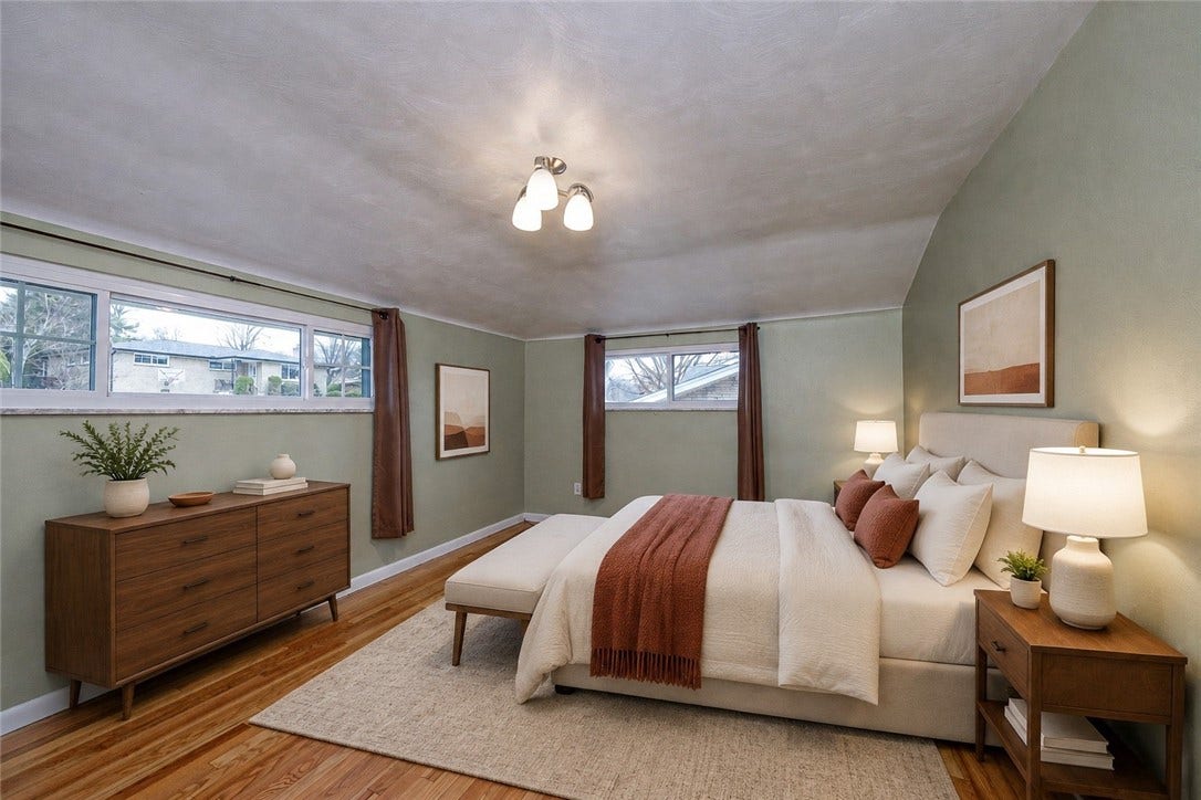 The master bedroom is very spacious and has plenty of closet space.