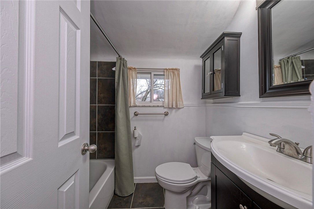 Updated full bathroom is conveniently located on the upper level adjacent to 2 of the bedrooms.