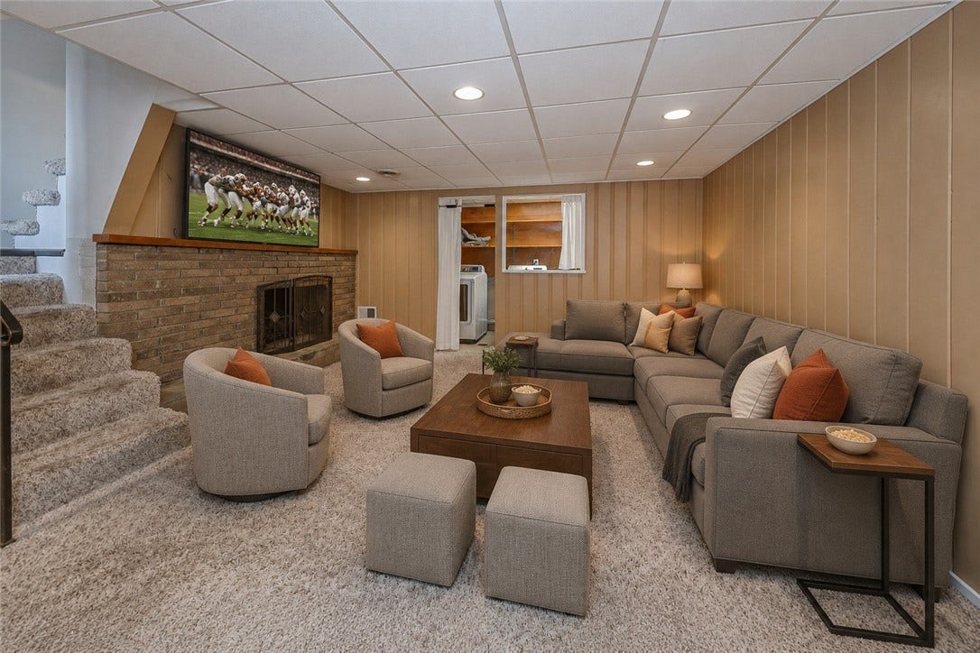 The finished lower level features a large game room ready for game-day gatherings.