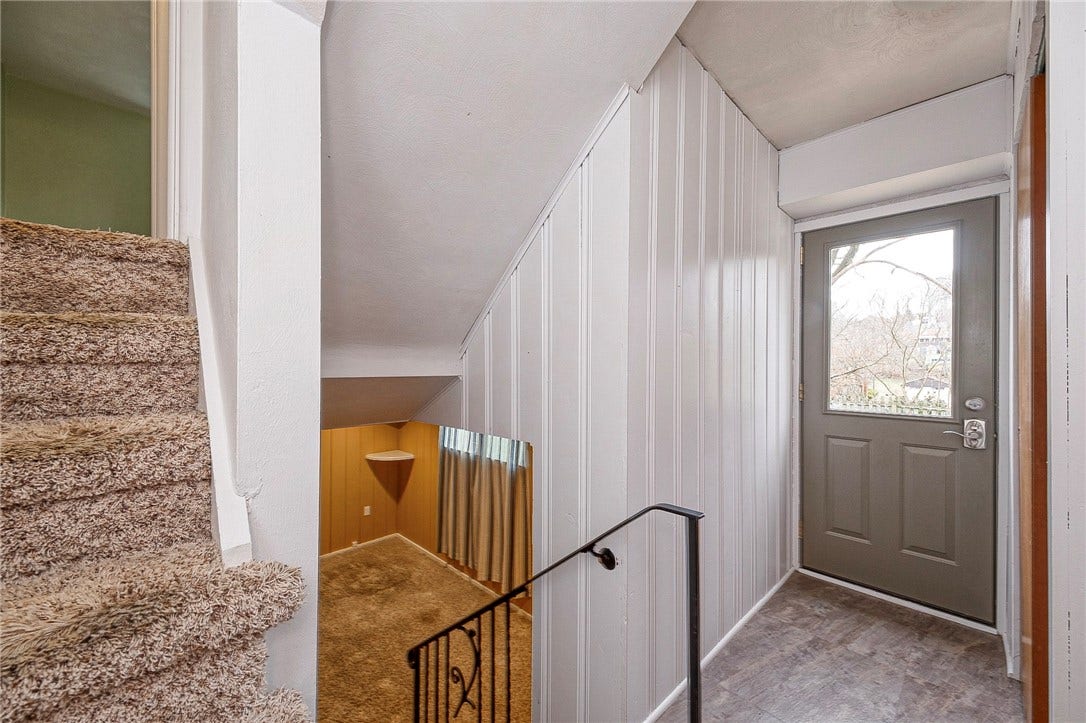 Lower level entrance provides access to the back yard, patio and deck.