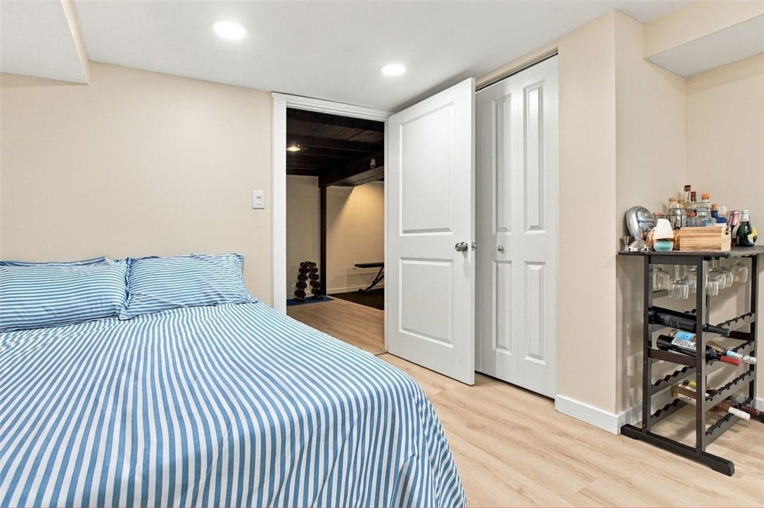 3rd bedroom located on the lower level includes a full bathroom and closet
