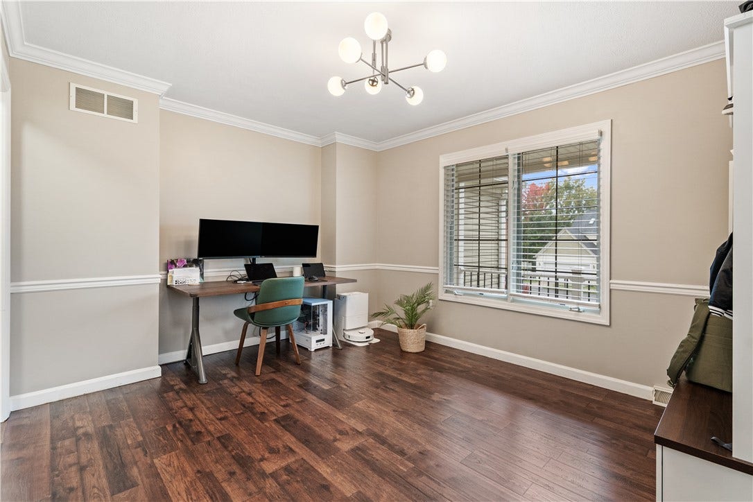 Chair rail, crown molding and stunning hardwood floors...