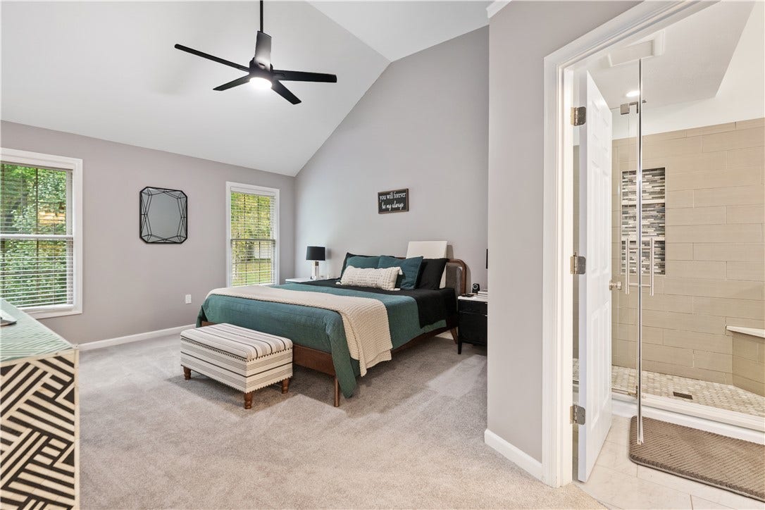 The primary bedroom has soaring ceilings...