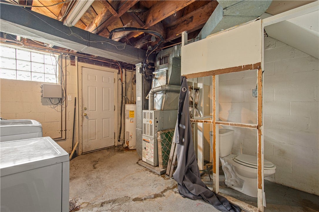 329 Macassar Dr, Pittsburgh, PA 15236 lower level laundry with partial bath