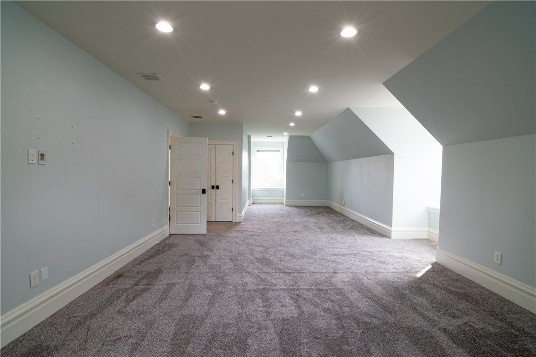 No need to put a TV on the 1st floor when there is a bonus living room on the top floor!