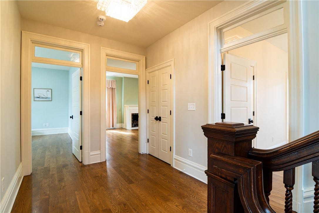 Second floor landing. Laundry, and 3 bedrooms.