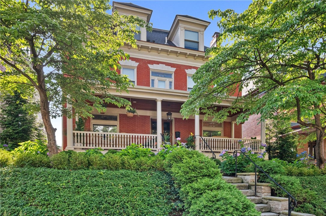 Classic, elegant and stately, 329 S. Graham is nestled in lush landscaping.