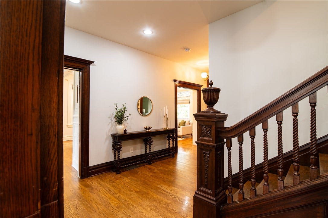 Something around each corner-the powder room is tucked beneath the stair case.