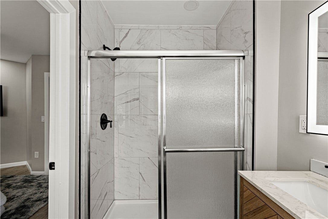214 N Aiken Ave, Pittsburgh, PA 15206 Tiled walk-in shower with glass door