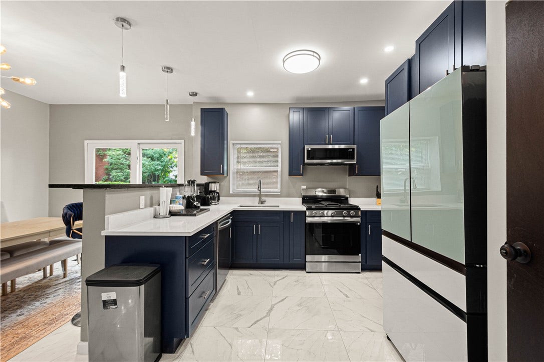 214 N Aiken Ave, Pittsburgh, PA 15206 Samsung appliances and open sightlines to the dining area