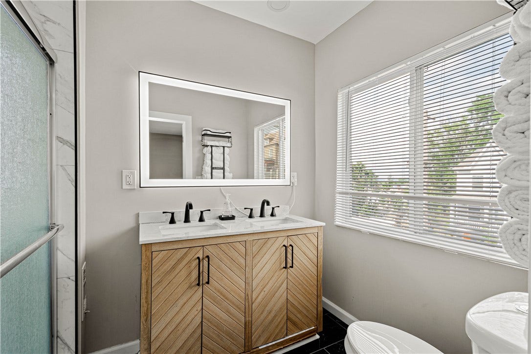 214 N Aiken Ave, Pittsburgh, PA 15206 Double vanity with backlit LED mirror