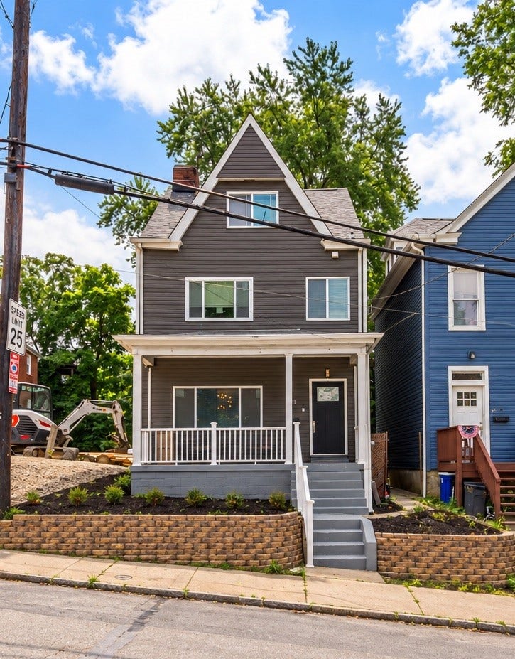 214 N Aiken Ave, Pittsburgh, PA 15206 Fully renovated 4-bedroom home with covered front porch.