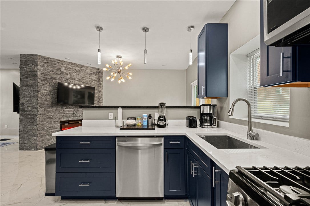 214 N Aiken Ave, Pittsburgh, PA 15206 Breakfast bar seating and quartz counters, open to dining