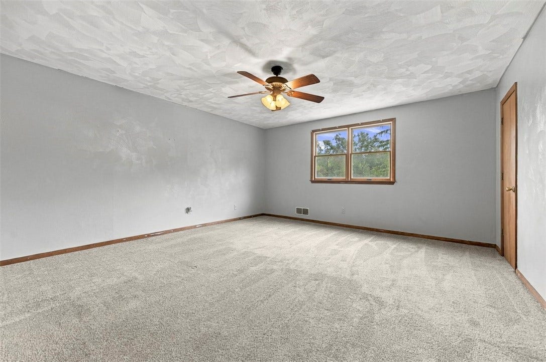 A very large upstairs 2nd bedroom with plenty of room to spread out and lots of variety for furniture placement.
