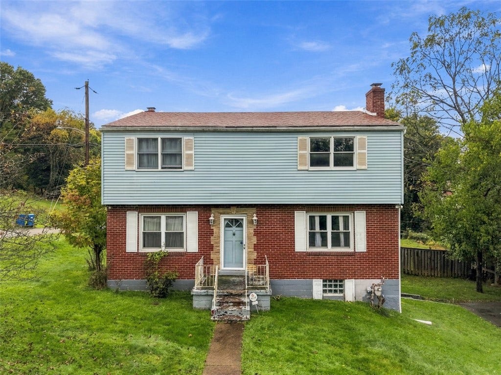 Two-story home on a spacious corner lot with classic curb appeal.